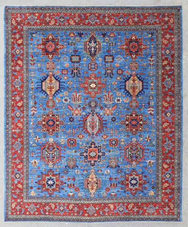 Knotted by hand in Afghanistan with hand-carded, hand-spun, vegetable-dyed wool. A classic Karaja design with roots in the village weaving traditions of northwestern Persia and the Caucasus. The bold geometric drawing with stepped medallions, angular floral motifs, and stylized protective symbols is set within a sky-blue field, framed by a richly detailed border of Herati medallion and leaf motifs.