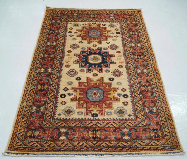 Afghan Lesghi Star Kazak rug knotted by hand with hand-carded, hand-spun, vegetable-dyed wool. Geometric medallion design from the northeast Caucasus.