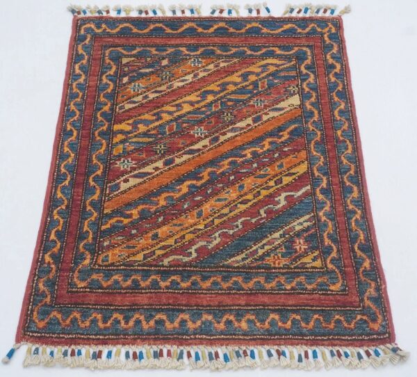 Afghan Genje rug knotted by hand with hand-spun, vegetable-dyed wool.