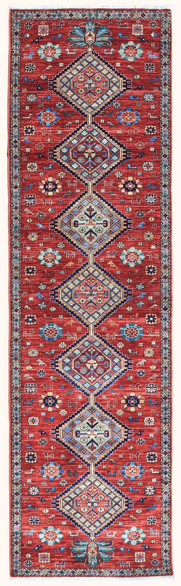 Afghan Kazak rug knotted by hand with hand-carded, hand-spun, vegetable-dyed wool.