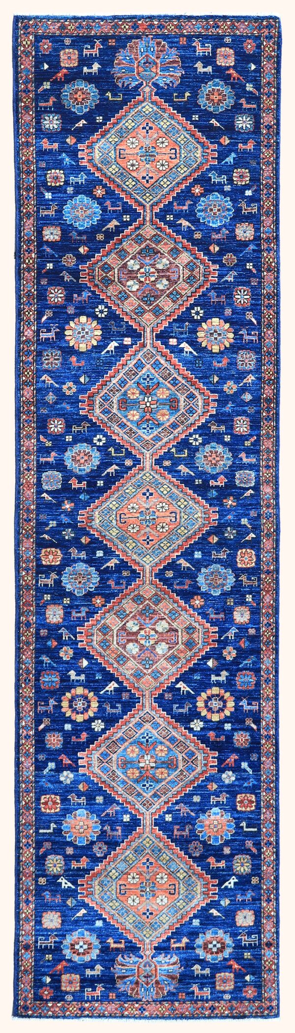 Afghan Kazak rug knotted by hand with hand-carded, hand-spun, vegetable-dyed wool.