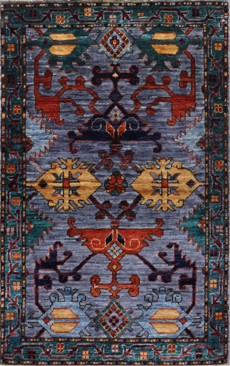Afghan Shirvan rug knotted by hand with hand-spun, vegetable-dyed wool. All-over jewel tone tribal medallions.