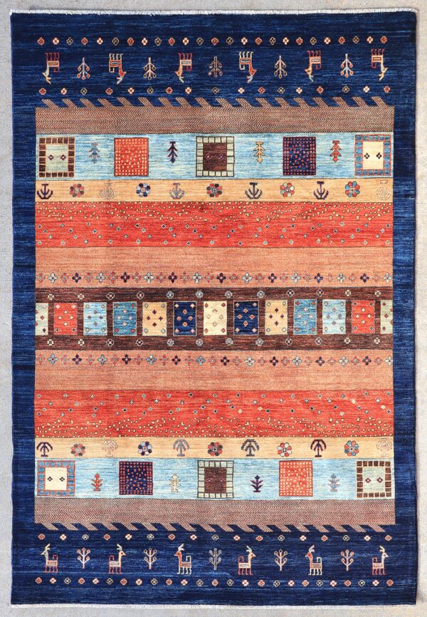 Afghan Gabbeh rug knotted by hand with hand-carded, hand-spun, vegetable-dyed wool.