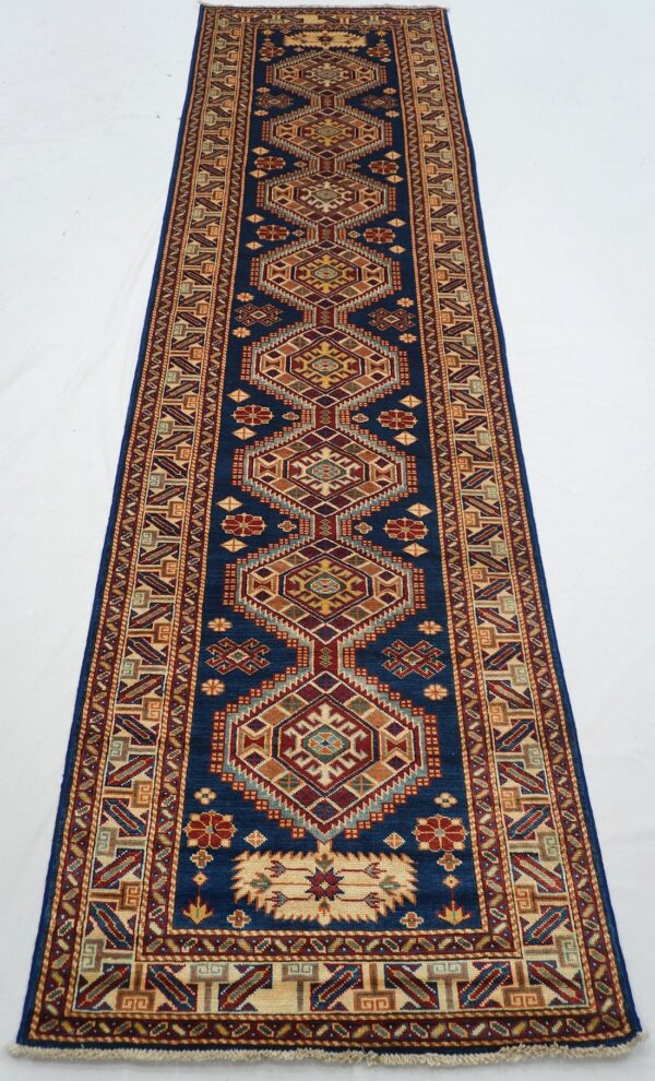 Afghan Kazak rug knotted by hand with hand-spun, vegetable-dyed wool.