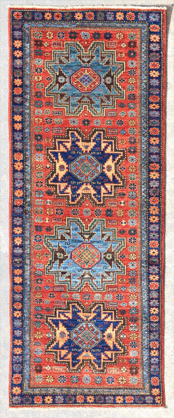 Afghan Lesghi Star Kazak rug knotted by hand with hand-carded, hand-spun, vegetable-dyed wool. Geometric medallion design from the northeast Caucasus.