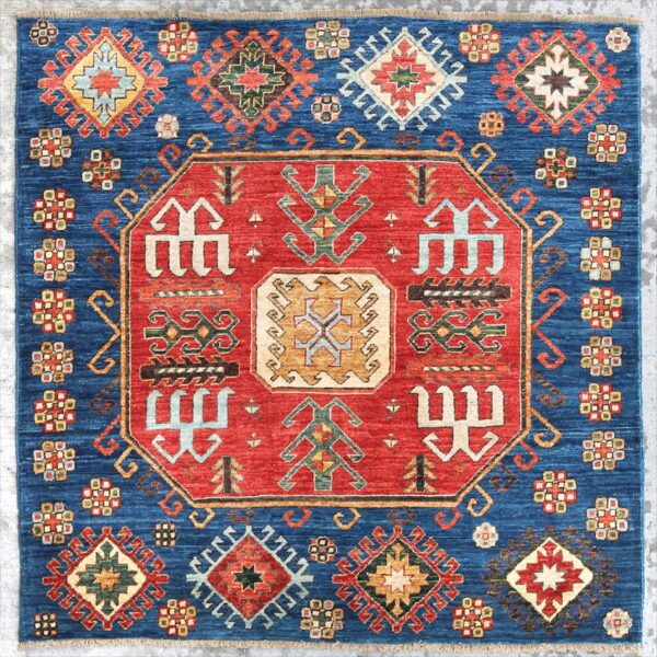 Afghan Kazak rug knotted by hand with hand-carded, hand-spun, vegetable-dyed wool.