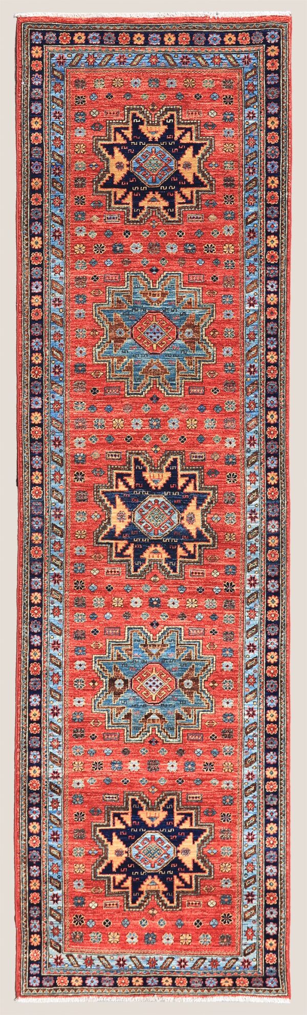 Afghan Lesghi Star Kazak rug knotted by hand with hand-carded, hand-spun, vegetable-dyed wool. Geometric medallion design from the northeast Caucasus.