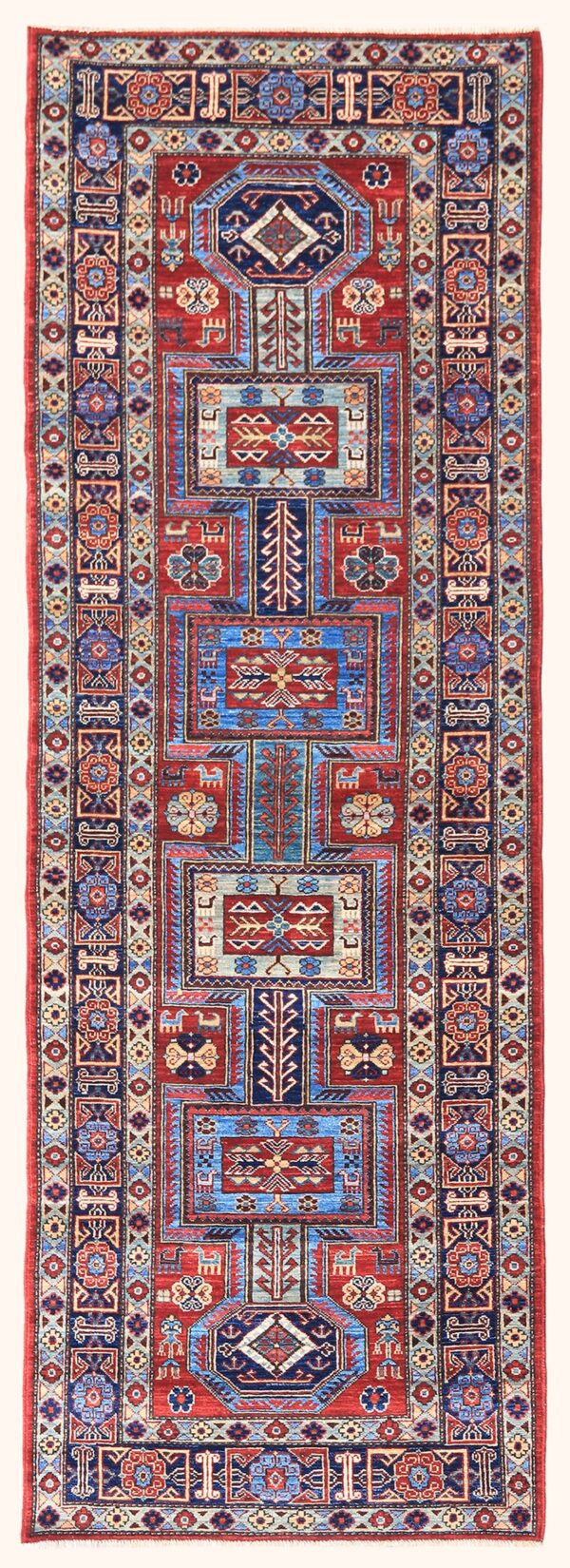 Afghan Keyhole Kazak rug knotted by hand with hand-carded, hand-spun, vegetable-dyed wool.