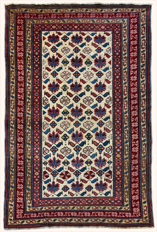 Antique Caucasian Kuba rug knotted by hand with hand-carded, hand-spun, vegetable-dyed wool.