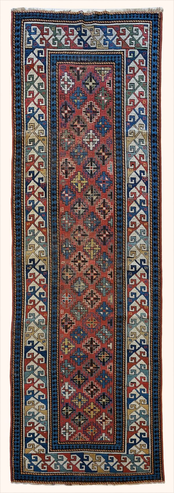 Antique Caucasian Kazak rug knotted by hand with hand-carded, hand-spun, vegetable-dyed wool.